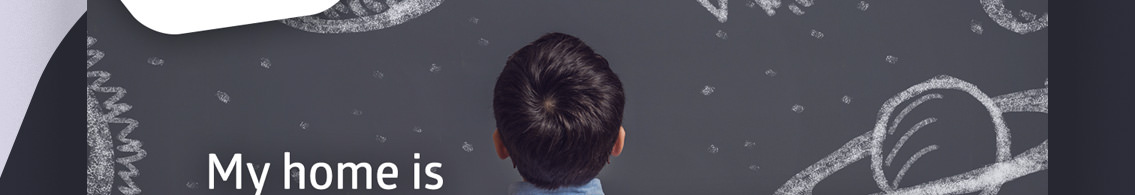 Text reading “My Home Is” and back on a child’s head.