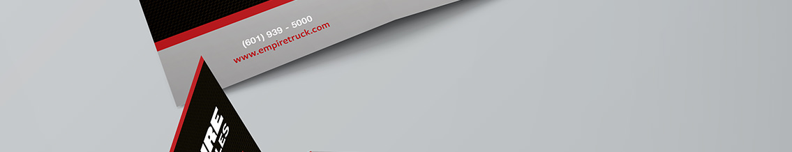 Small sections of tri-fold brochures, one with text reading, “www.empiretruck.com.”