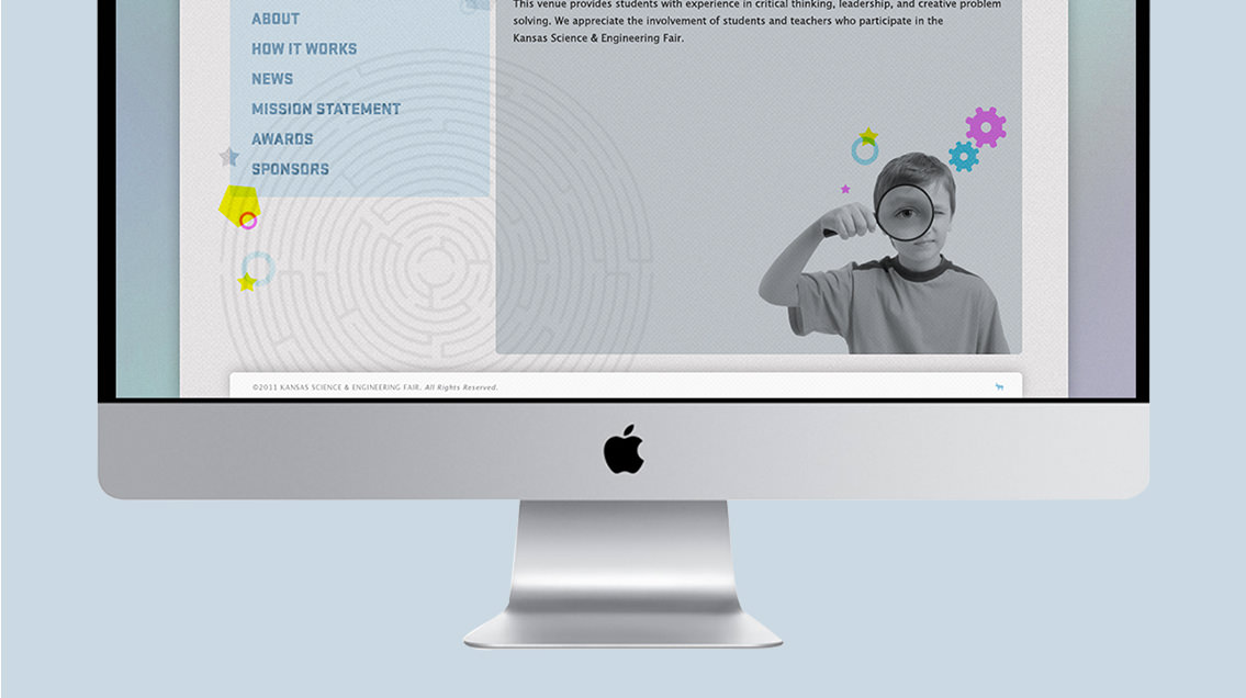 Little boy holding magnifying glass.