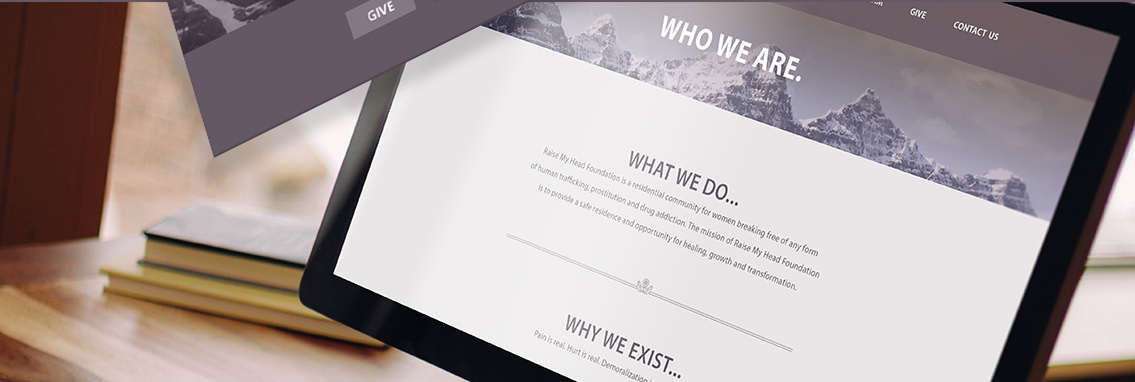 Demonstration of the “Raise My Head Foundation” website on a large monitor.