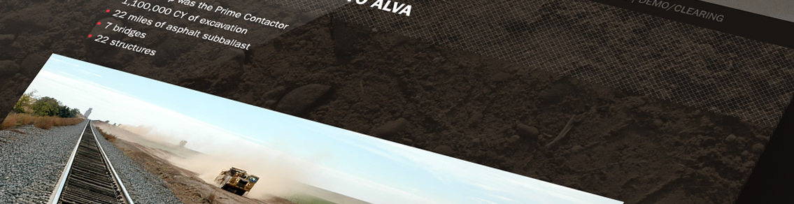 Railroad tracks in front of construction worksite.