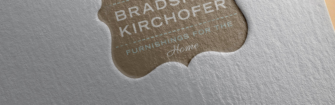 Close-up view of Bradshaw Kirchofer's embossed logo, designed by Entermotion, a Wichita web-design studio.