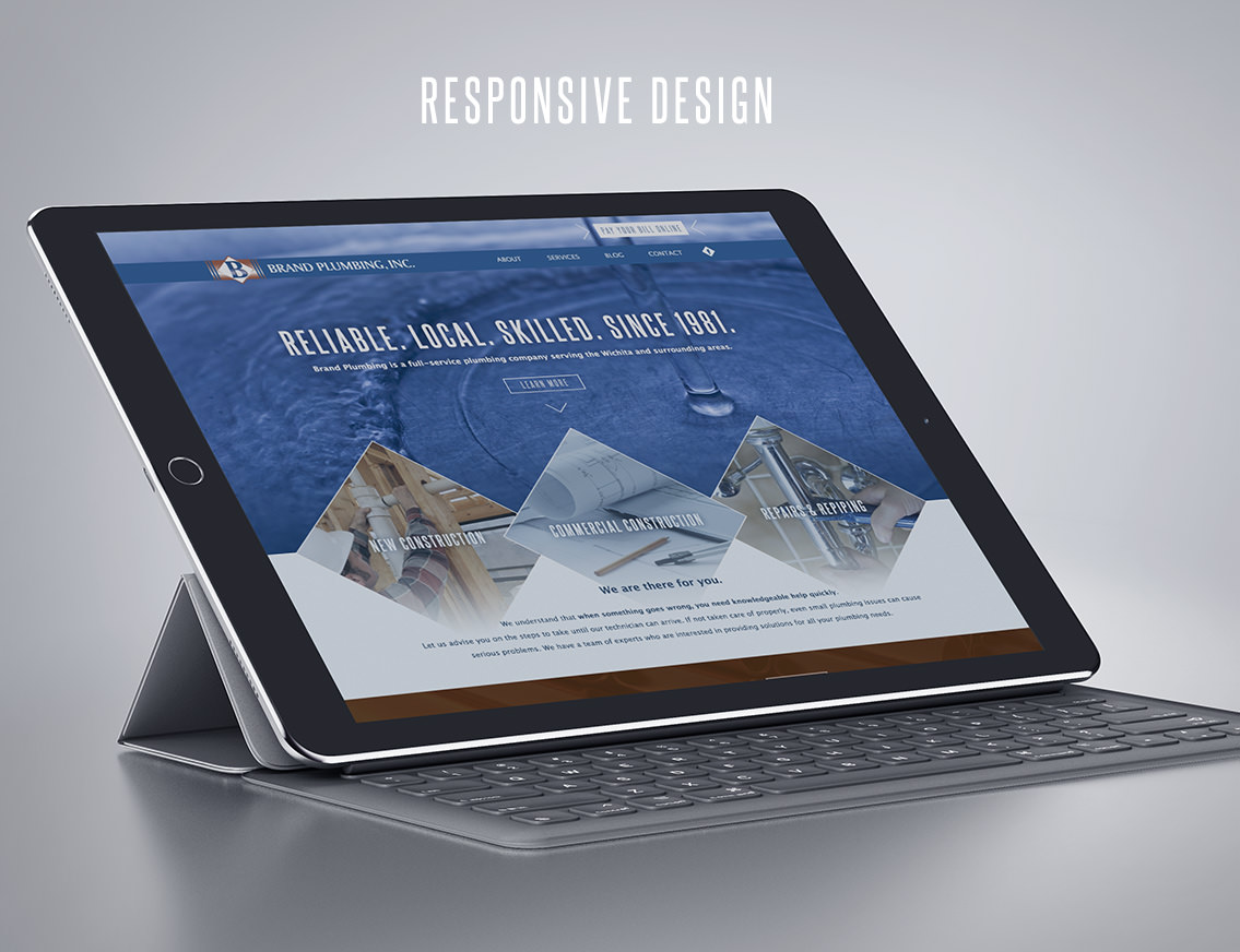 Brand Plumbing website displayed on tablet.