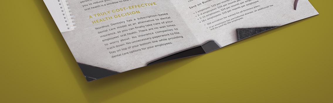 Nordhus Dentistry ad, featuring a smiling man and woman sitting at a reception desk.