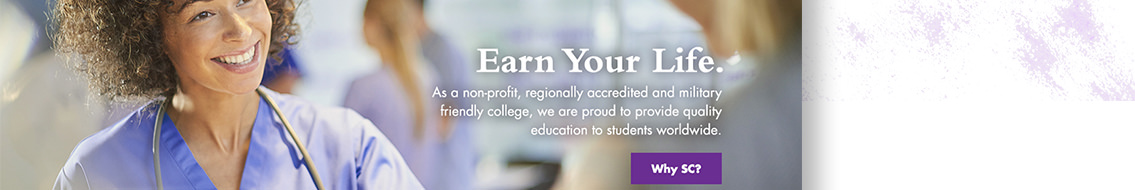 Woman in blue scrubs smiling.